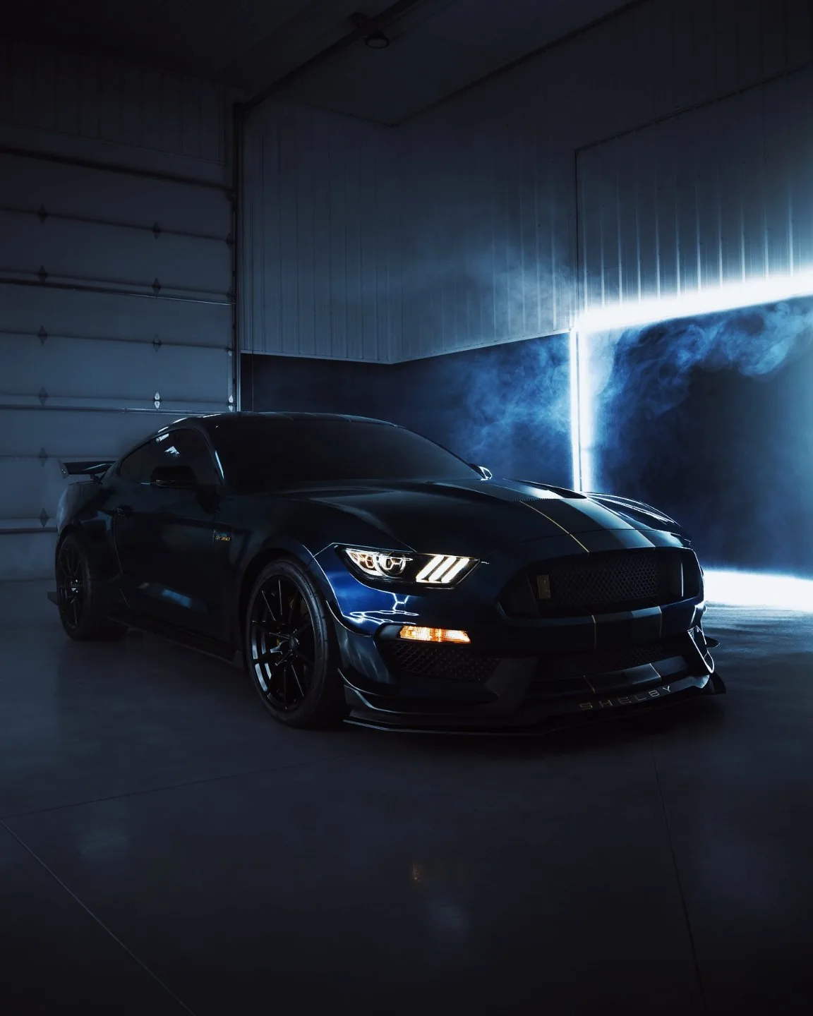 Midnight blue Mustang Shelby GT350 in smoke at the Vinyl Drip shop